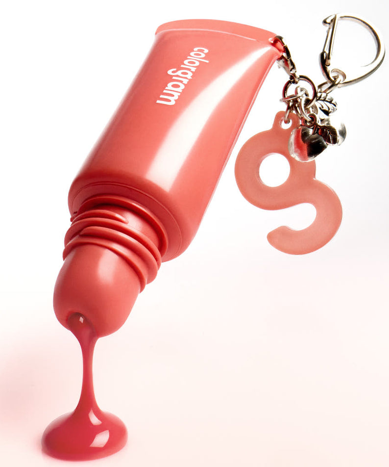 COLORGRAM Tanghulu Lip Serum 9g, tube de sérum pour lèvres de la marque COLORGRAM, sur fond blanc, goutte rouge et pendentif