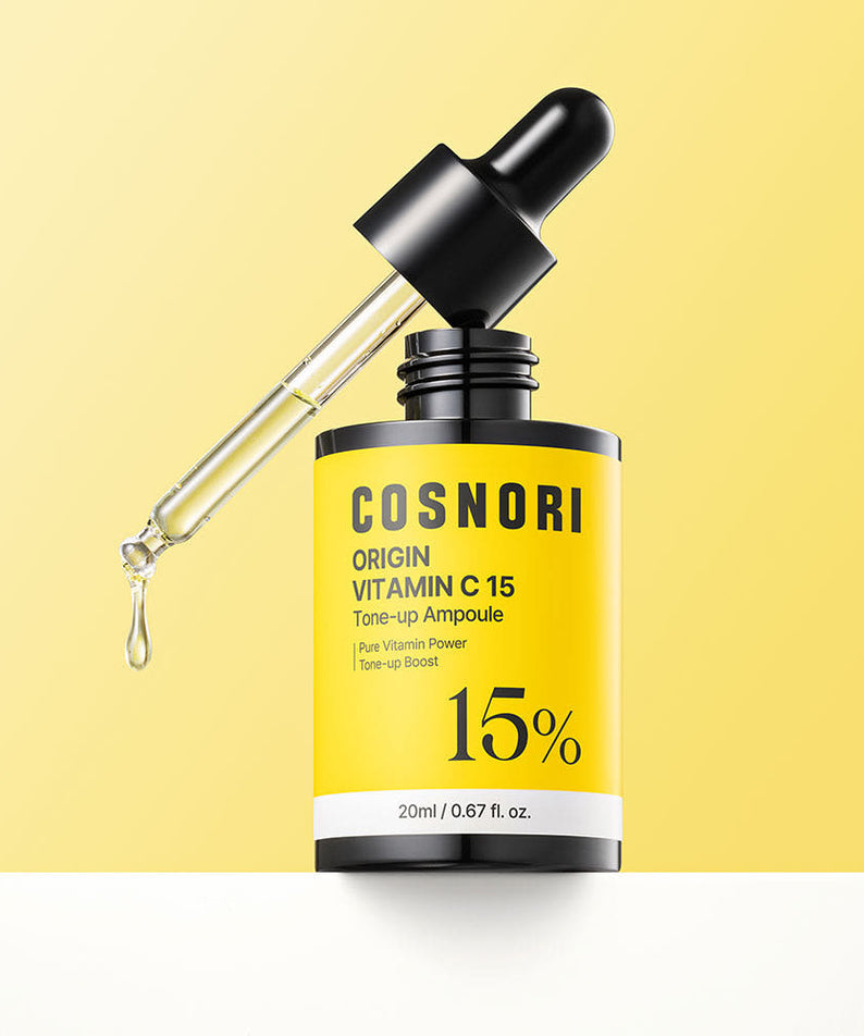 COSNORI Origin Vitamin C 15 Tone-Up Ampoule 20ml de COSNORI, sérum jaune sur fond clair avec goutte