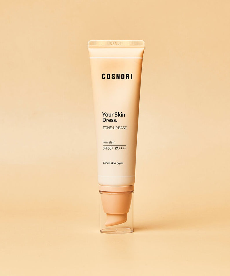COSNORI Your Skin Dress Tone-Up Base 50ml, tube crème sur fond beige, marque COSNORI en contexte cosmétique.
