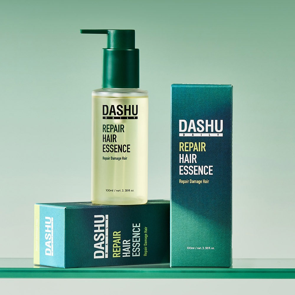 DASHU Daily Repair Hair Essence 100ml, flacon et coffret sur fond vert, marque DASHU, soin capillaire visible en studio.