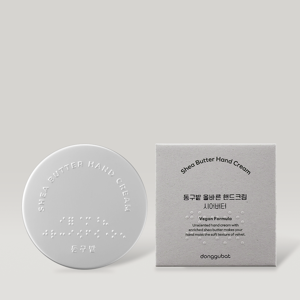 DONGGUBAT Correct Hand Cream Shea Butter, crème pour les mains posée sur fond clair avec boîte, marque visible.