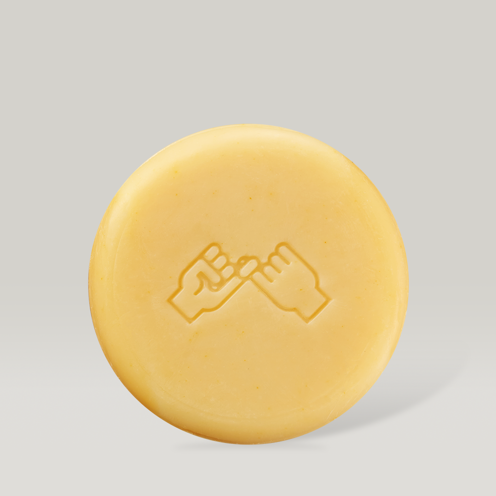 Décris l'image en français en mentionnant le produit, la marque et le contexte visuel : DONGGUBAT Correct Shampoo Bar For Oily Skin.