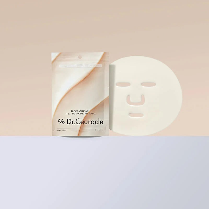 DR.CEURACLE Expert Collagen Firming Modeling Mask 30g, masque visage sur fond clair avec packaging, ambiance spa.