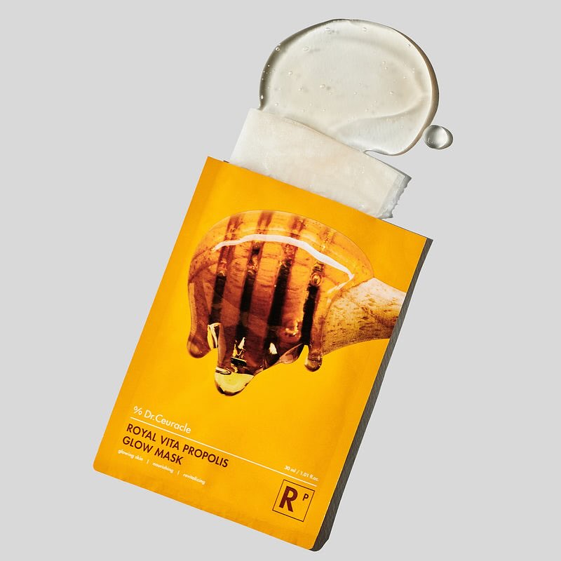 DR.CEURACLE Royal Vita Propolis Glow Mask (10EA) de la marque sur fond clair, masque visage en sachet doré.