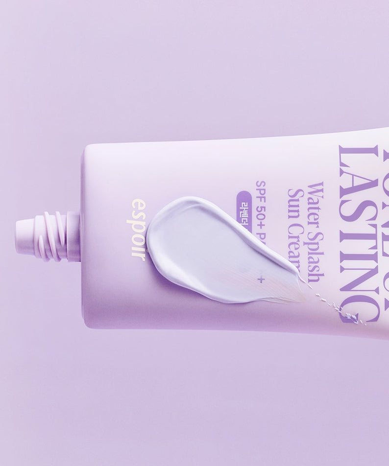 Crème solaire ESPOIR Water Splash Sun Cream Tone Up Lasting SPF 50+ PA++++ en tube sur fond violet, protection solaire efficace.
