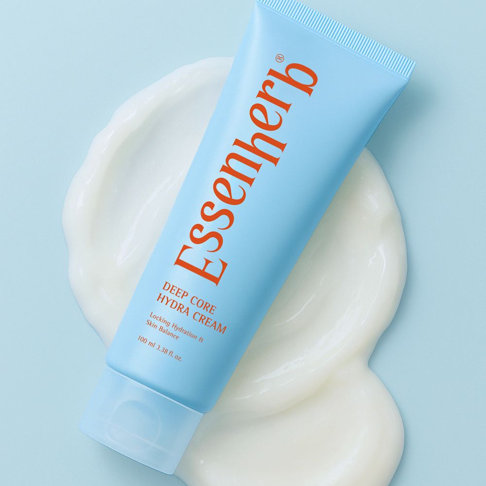 ESSENHERB Deep Core Hydra Cream 100ml de la marque Essenh erb, tube bleu sur fond bleu, crème hydratante