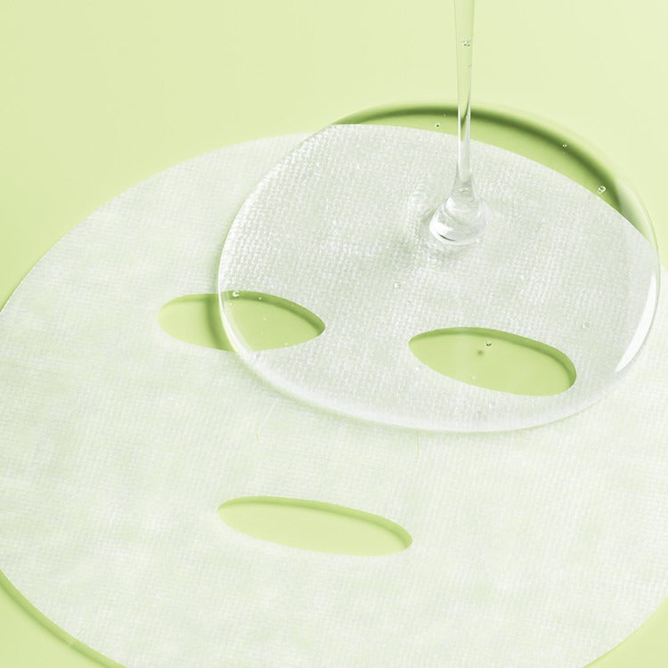 ESSENHERB  Kummerowia Poresetting Cotton Mask 5EA, masque en coton blanc sur fond vert avec sérum.