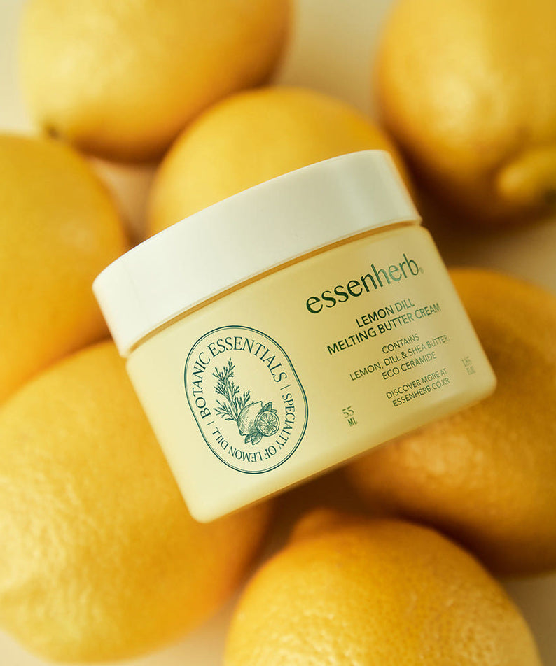 ESSENHERB Lemon Dill Melting Buttercream 55ml avec des citrons frais en arrière-plan