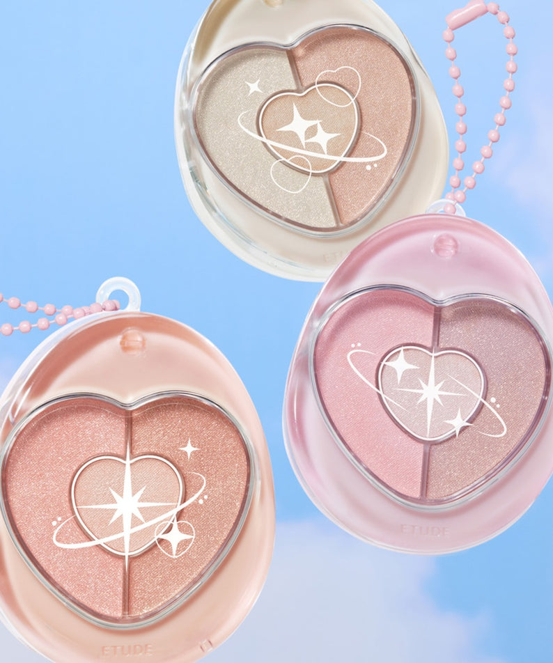 Décris l'image en français : ETUDE  Poyong Eye Maker, palette yeux en cœur rose sur fond bleu, bulles et perles