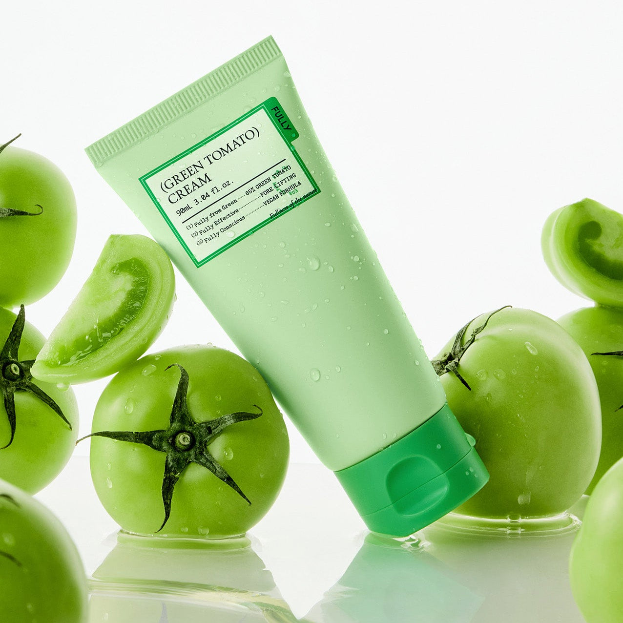 FULLY Green Tomato Cream Tube 90ml, crème pour le visage FULLY, tube vert avec tomates vertes sur fond blanc, gouttes
