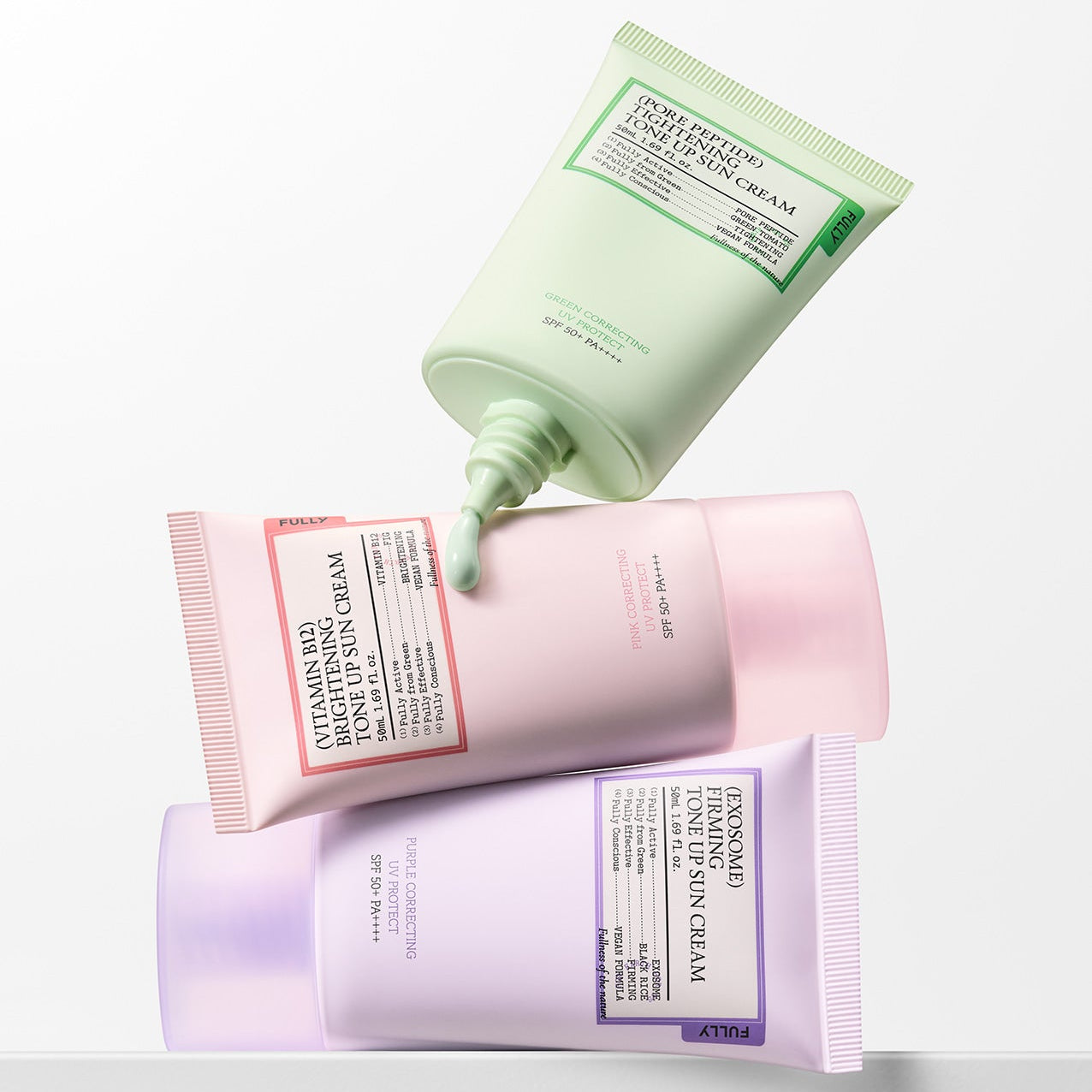 FULLY Tone-up Sunscreen 3-Piece Set FULLY, tubes crème solaire sur fond clair, look skincare moderne