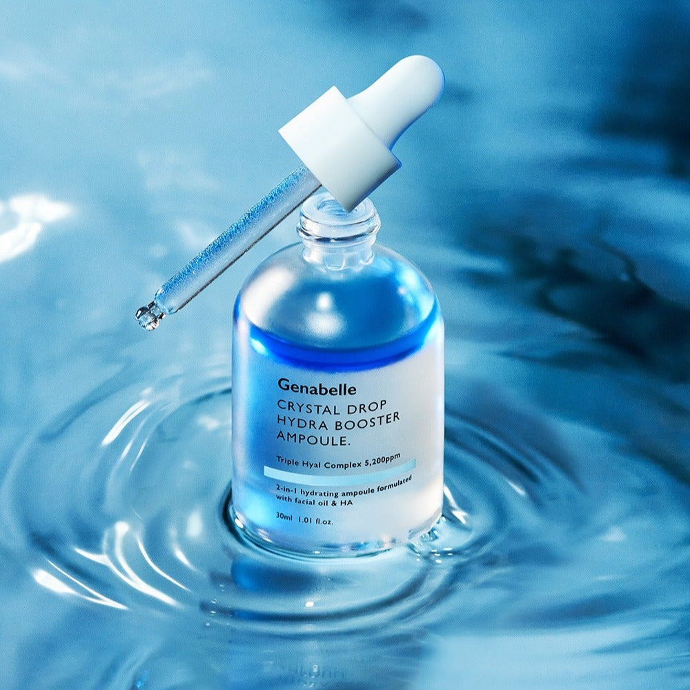 GENABELLE Crystal Drop Hydra Booster Ampoule 30ml de Genabelle : ampoule bleue sur fond aquatique, goutte de soin.