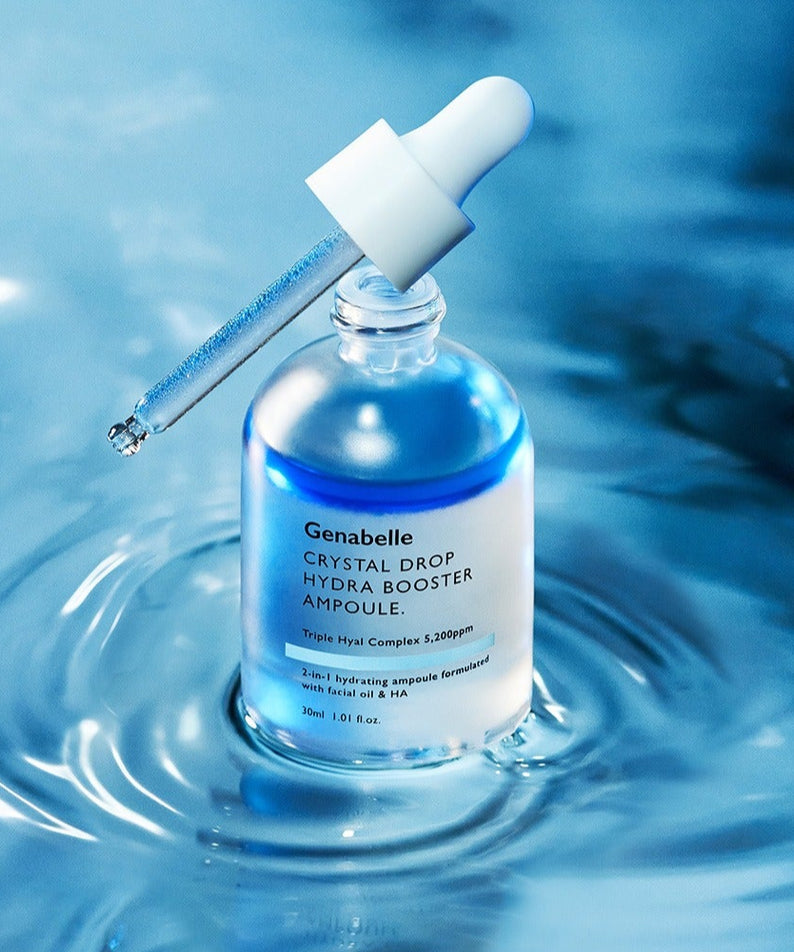 GENABELLE Crystal Drop Hydra Booster Ampoule 30ml en bouteille sur fond aquatique, hydratation intense et éclat de la peau.