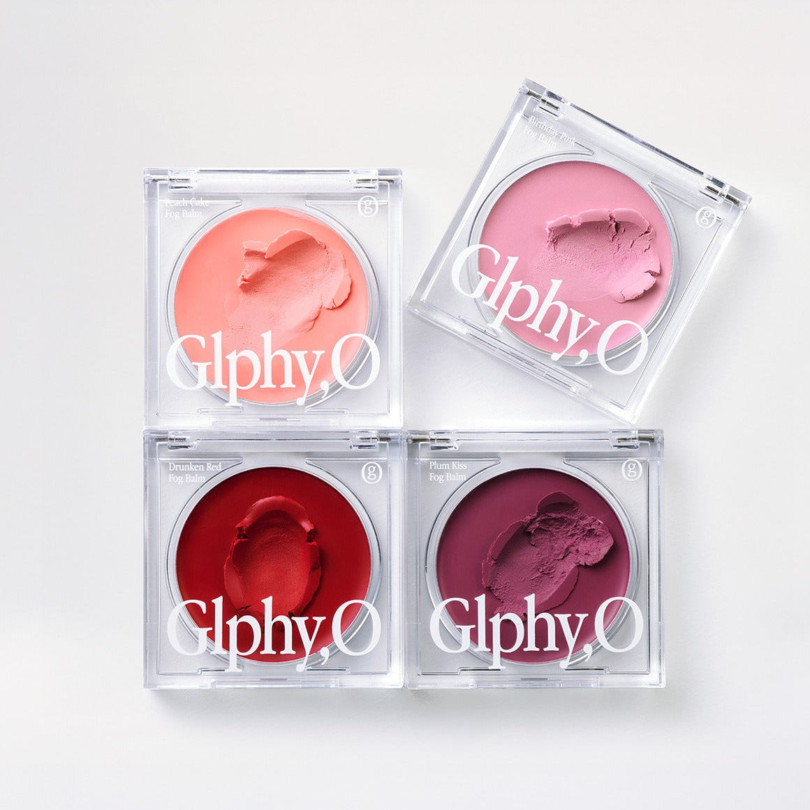 GLPHYO Fog Balm3.2g de la marque GLPHYO, pots de baume colorés en packaging transparent sur fond clair