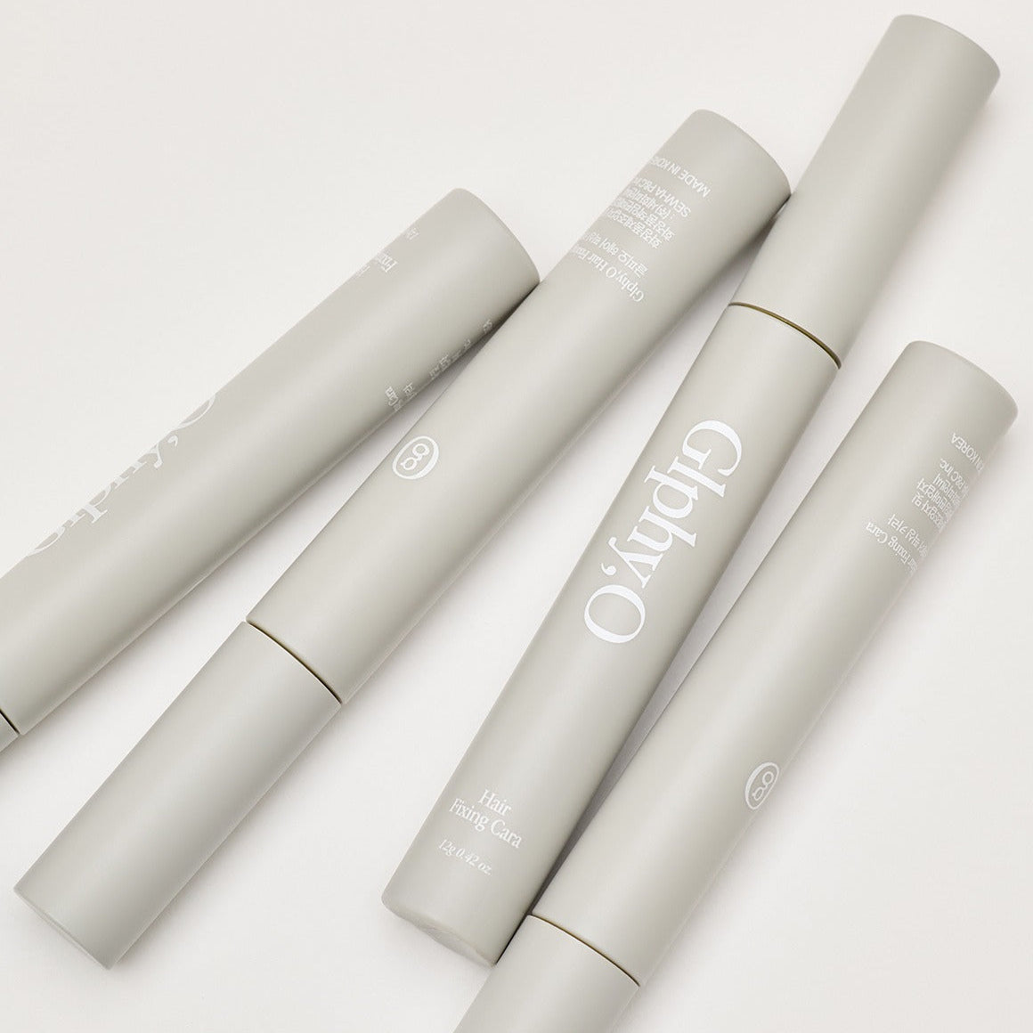 GLPHYO Hair Fixing Cara 12g de la marque GLPHYO, présentée sur fond clair, tubes de produit pour coiffage.