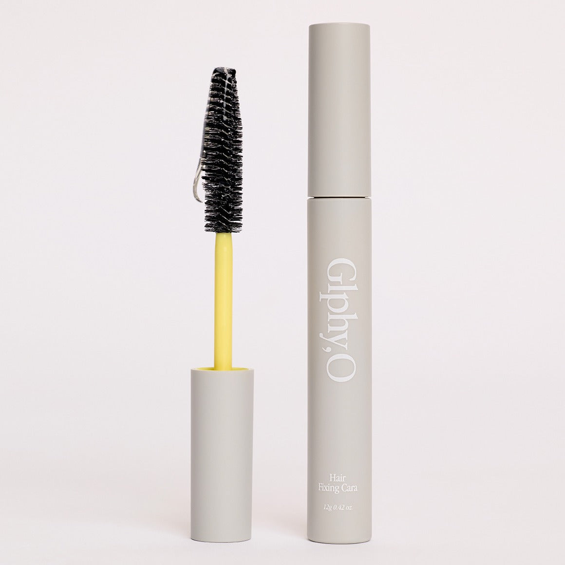GLPHYO Hair Fixing Cara 12g de la marque GLPHYO, avec mascara et brosse sur fond clair, produit en gros plan.