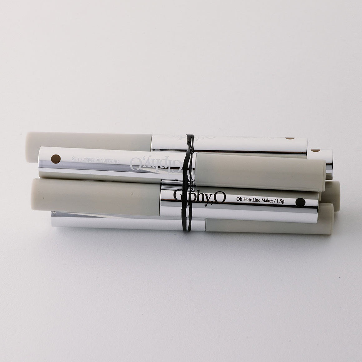 GLPHYO Hairline Maker 1.5g, sur fond clair, maquillage des sourcils, tube et capuchon, marque GLPHYO en gros plan.