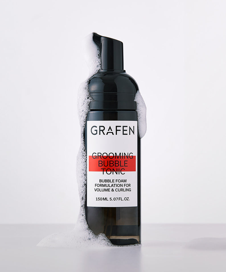 GRAFEN  Grooming Bubble Tonic 150ml, bouteille noire sur fond clair, mousse blanche visible sur l’image.
