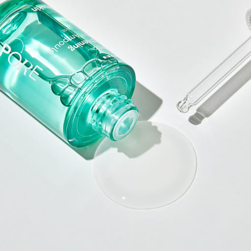 HANSKIN Magic Tightening Pore Ampoule 30ml, flacon vert sur fond blanc, contexte soin visage cosmétique