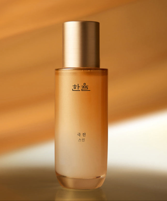 HANYUL Extreme Skin 125ml : flacon cosmétique doré sur fond chaleureux, ambiance soins skincare de la marque HANYUL