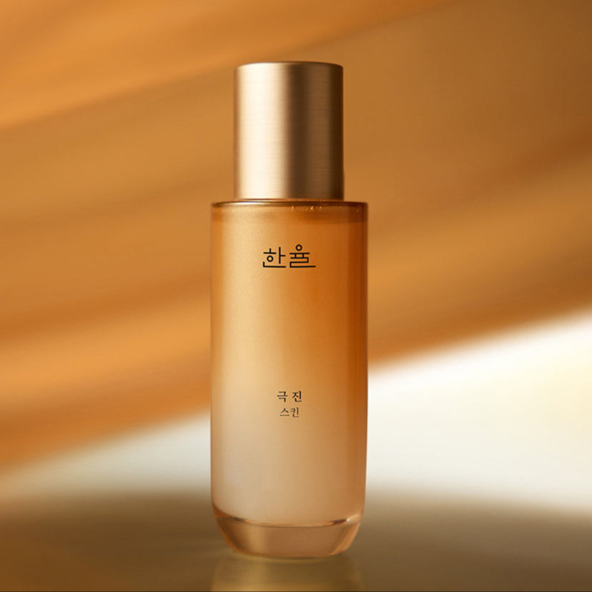HANYUL Extreme Skin 125ml : flacon cosmétique doré sur fond chaleureux, ambiance soins skincare de la marque HANYUL