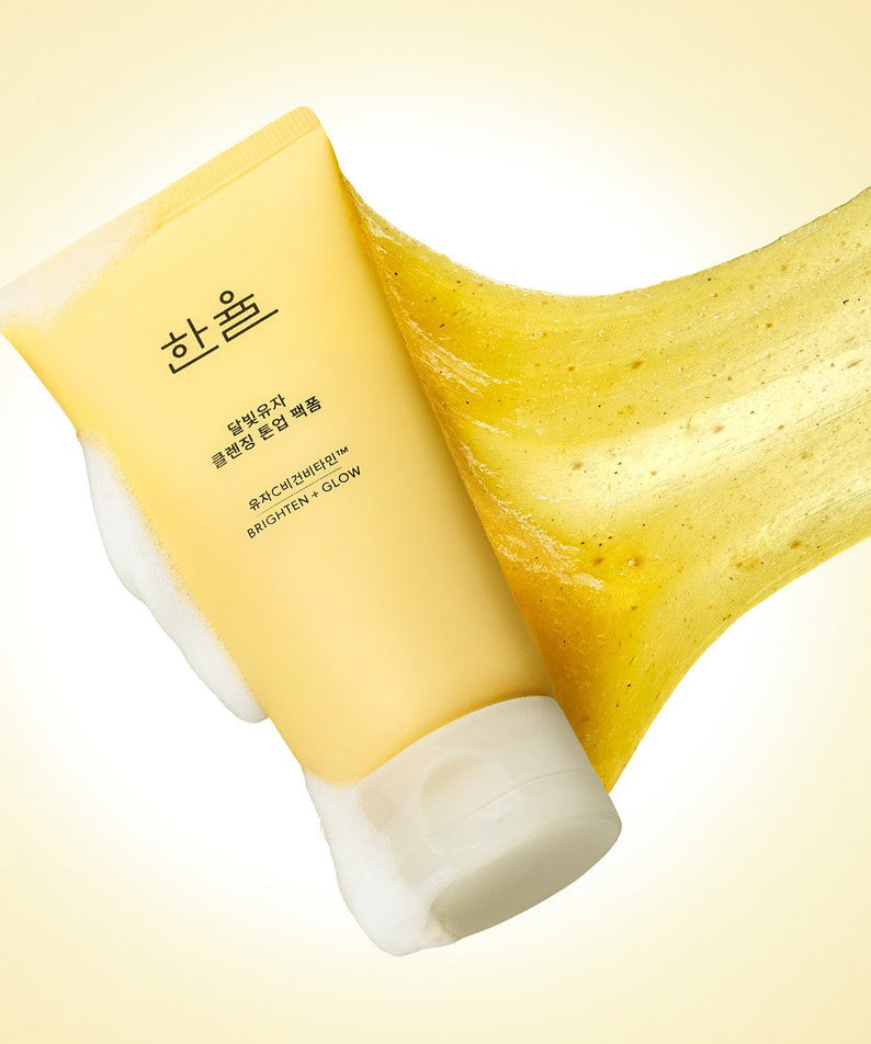 HANYUL Moonlight Yuja Vitamin Tone-Up Pack Foam 120ml : tube crème et feuille de yuzu, visuel lumineux jaune.