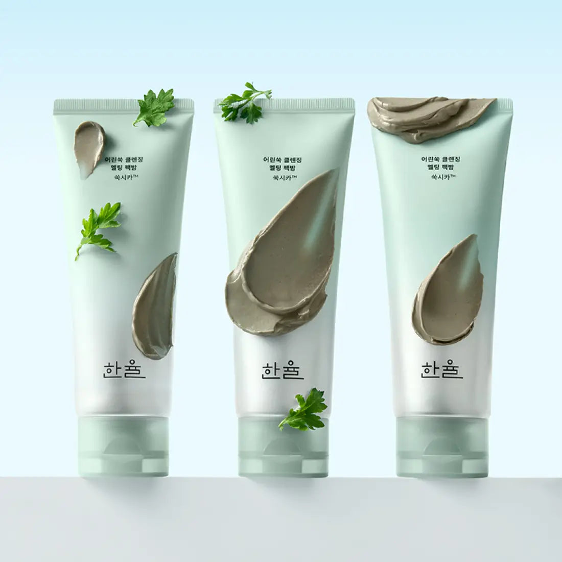 HANYUL Young Artemisia Cleansing Pack Balm 100g, baume nettoyant à l’armoise, marques et tubes verts sur fond clair