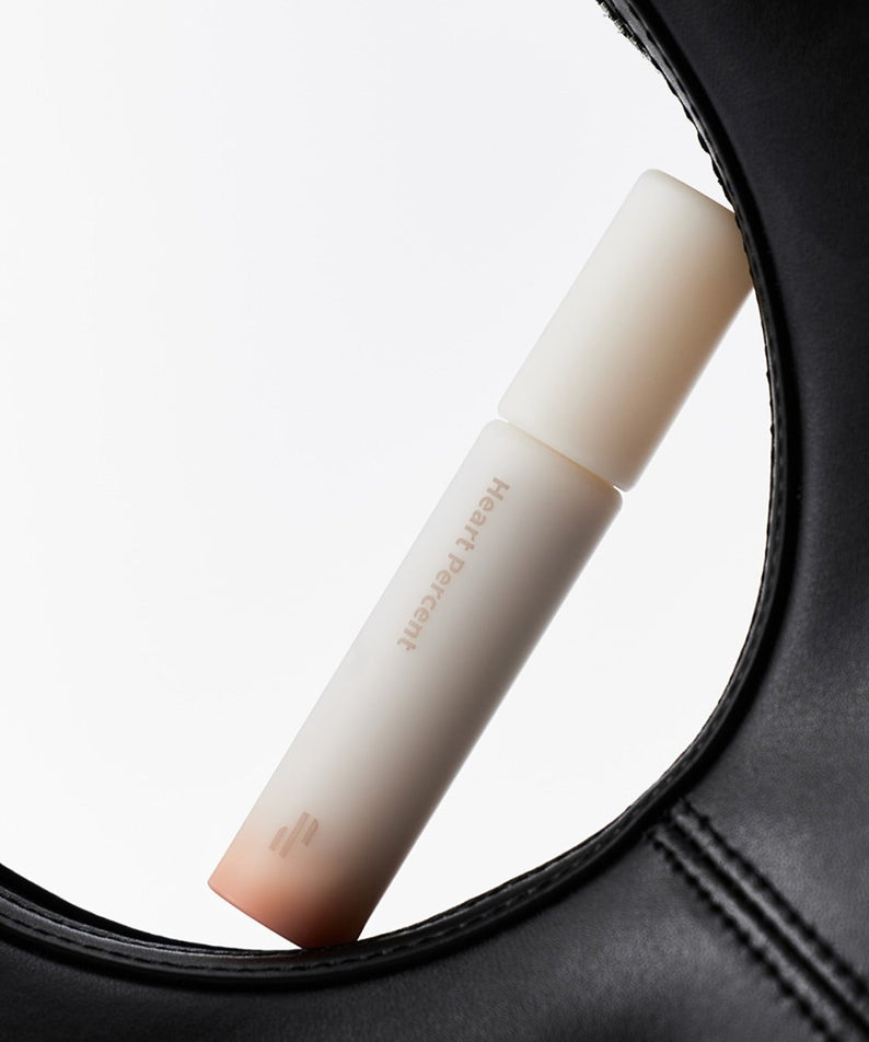 HEART PERCENT Dot On Mood All Cover Lip Base présenté dans un design élégant, mise en valeur sur fond minimaliste.
