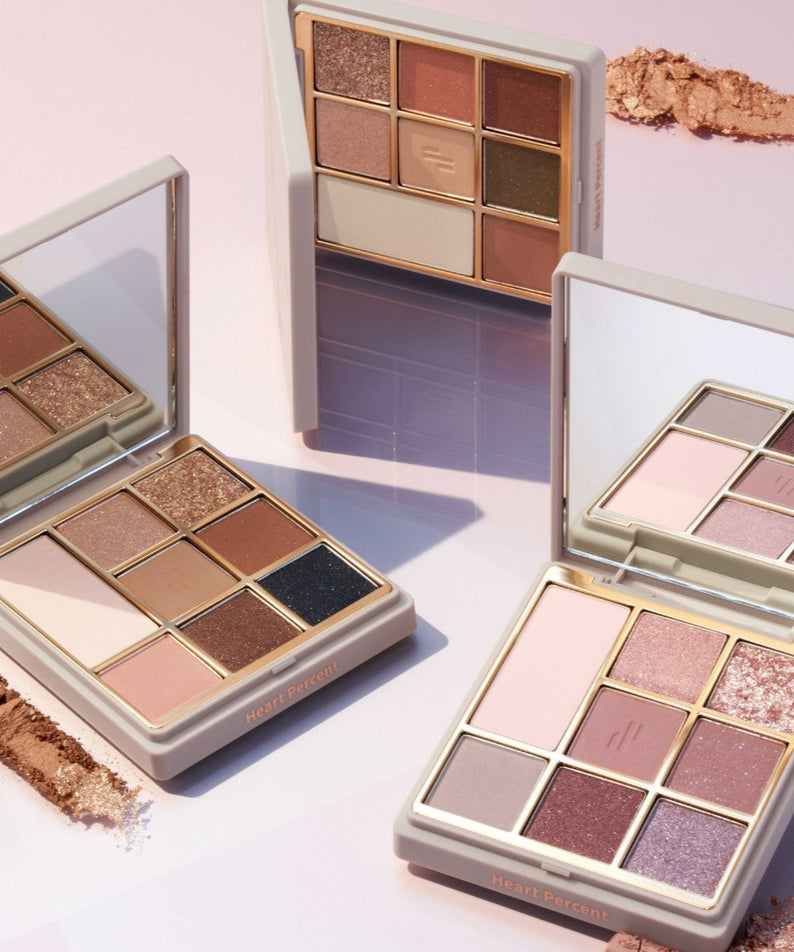 Palette de fards à paupières HEART PERCENT Dot On Mood Eye Palette avec nuances neutres et pailletées.