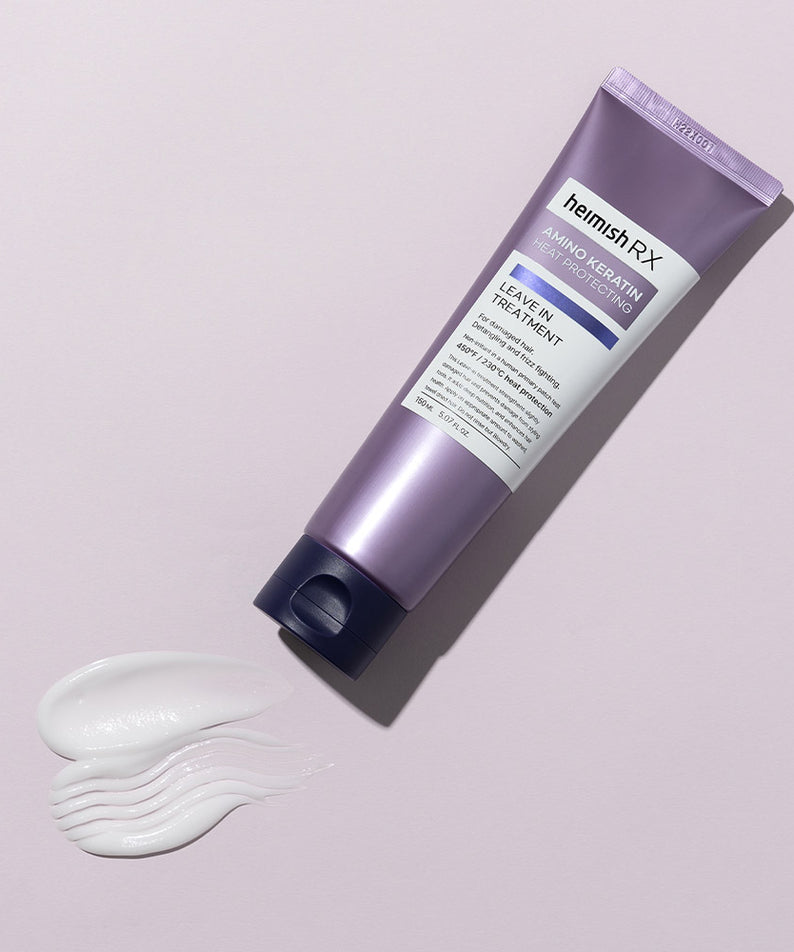 HEIMISH RX Amino Keratin Heat Protecting Leave-in Treatment 150ml sur fond rose, crème blanche étalée à côté.