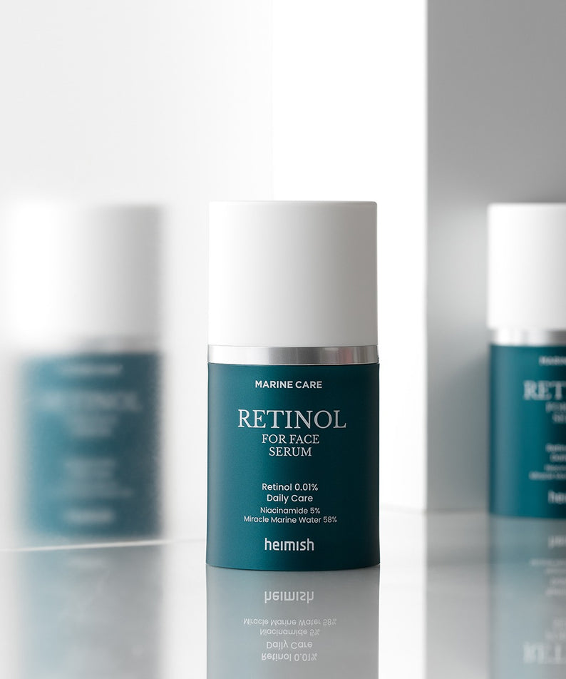 HEIMISH Marine Care Retinol For Face Serum 50ml sur une surface réfléchissante, soin visage puissant pour une peau éclatante.