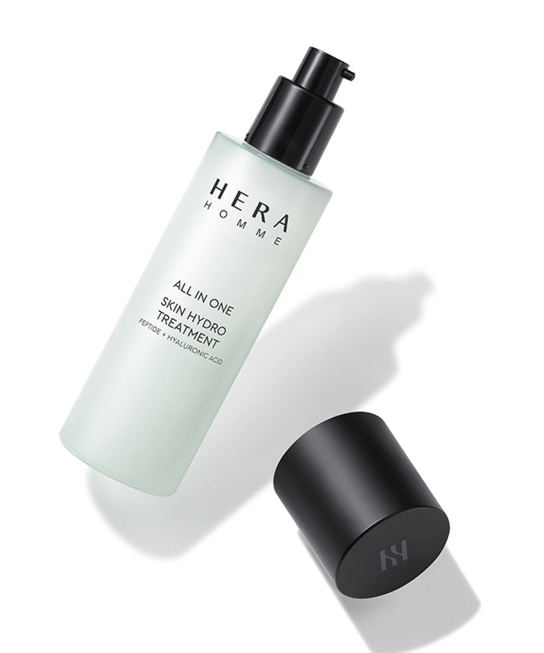 Flacon de HERA Homme All-in-One Skin Hydro Treatment 150ml, soin hydratant pour homme, bouteille avec pompe et bouchon noir.