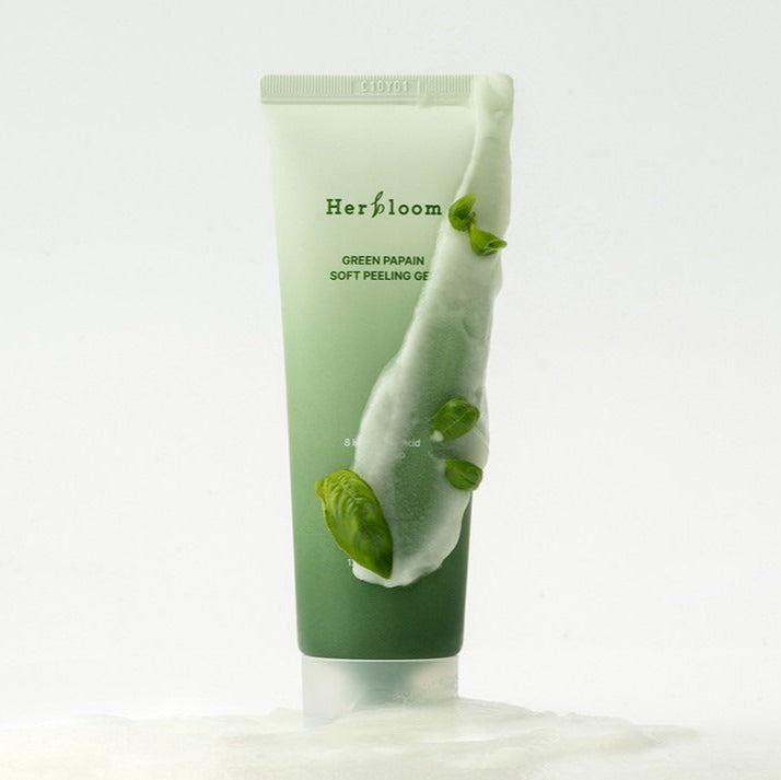 HERBLOOM  Green Papain Soft Peeling Gel 120g, tube vert Herblooom sur fond blanc, avec feuilles de papaye