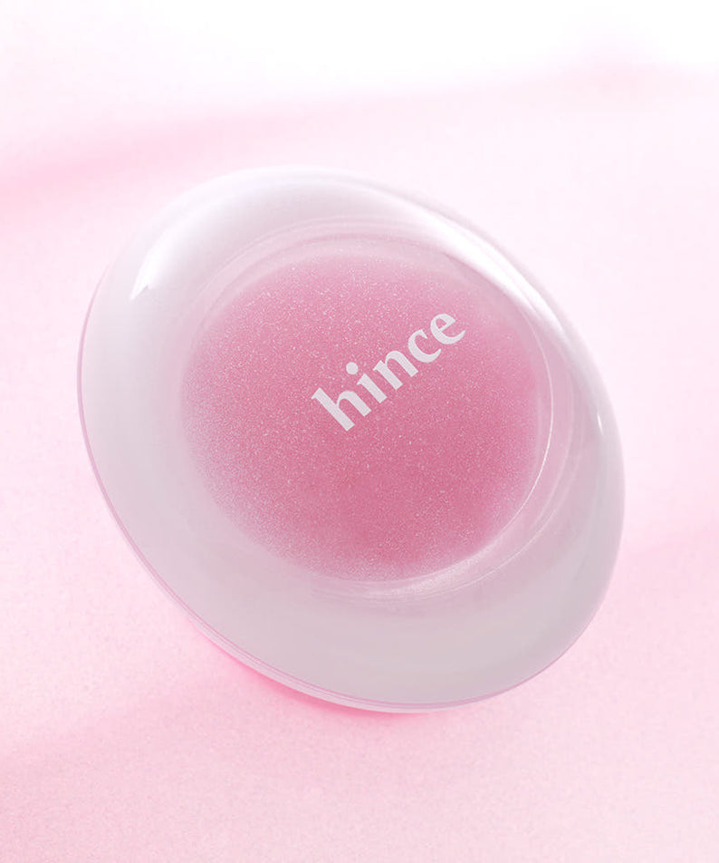 HINCE Low Glow Dewy Ball (Lip & Cheek) cosmétique pour lèvres et joues, sur fond rose élégant.