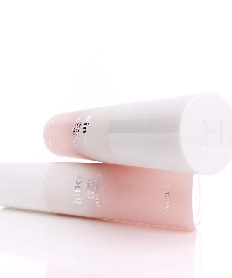 Deux bouteilles de HINCE Radiance Makeup Boosting Prep 30ml sur fond blanc, rehaussant l'éclat du maquillage.