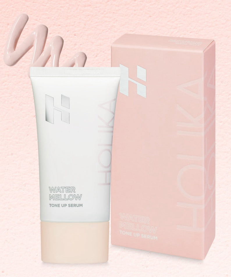 HOLIKA HOLIKA Water Mellow Tone-Up Serum, flacon et étui rose sur fond crème, marque HOLIKA, soin visage
