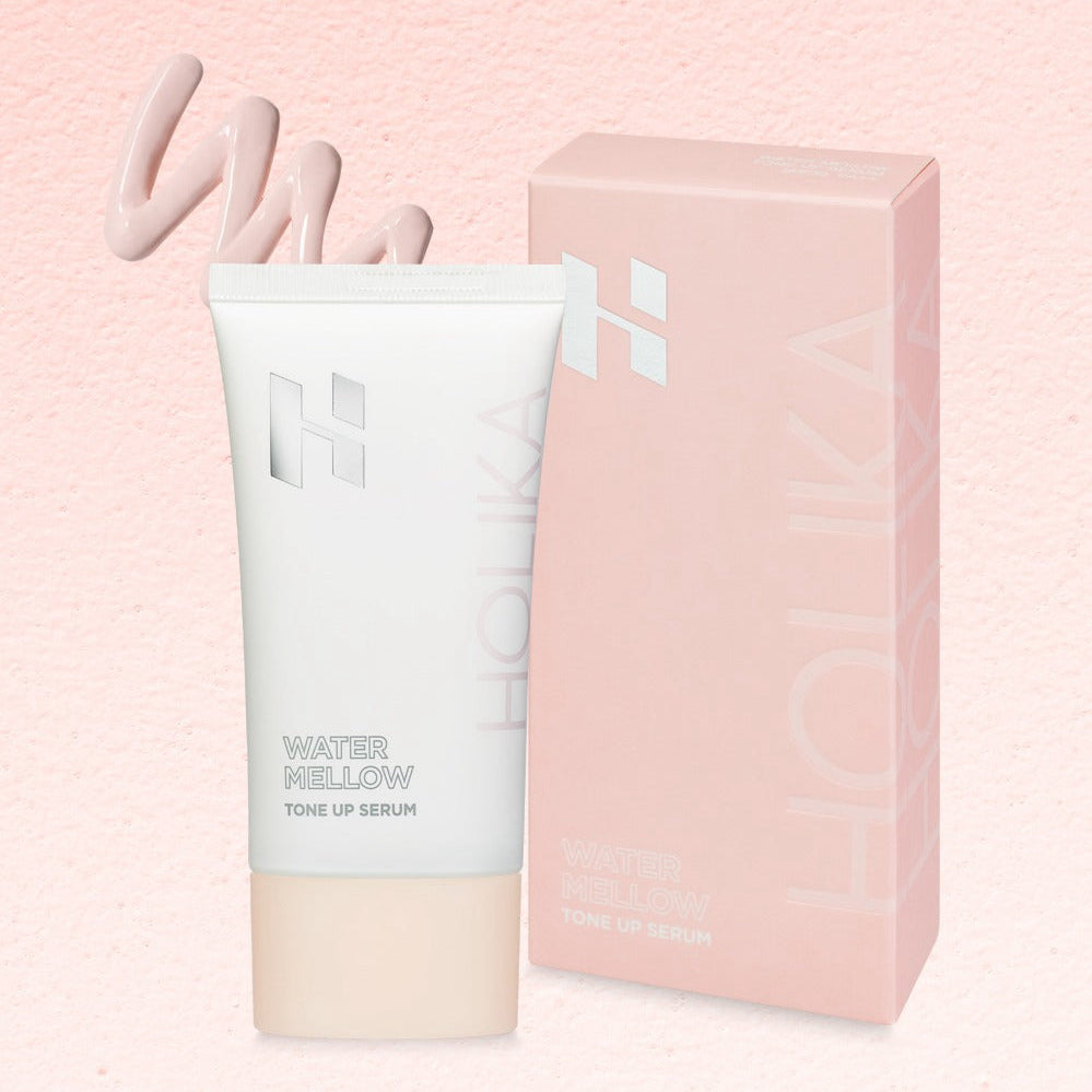 HOLIKA HOLIKA Water Mellow Tone-Up Serum, flacon et étui rose sur fond crème, marque HOLIKA, soin visage