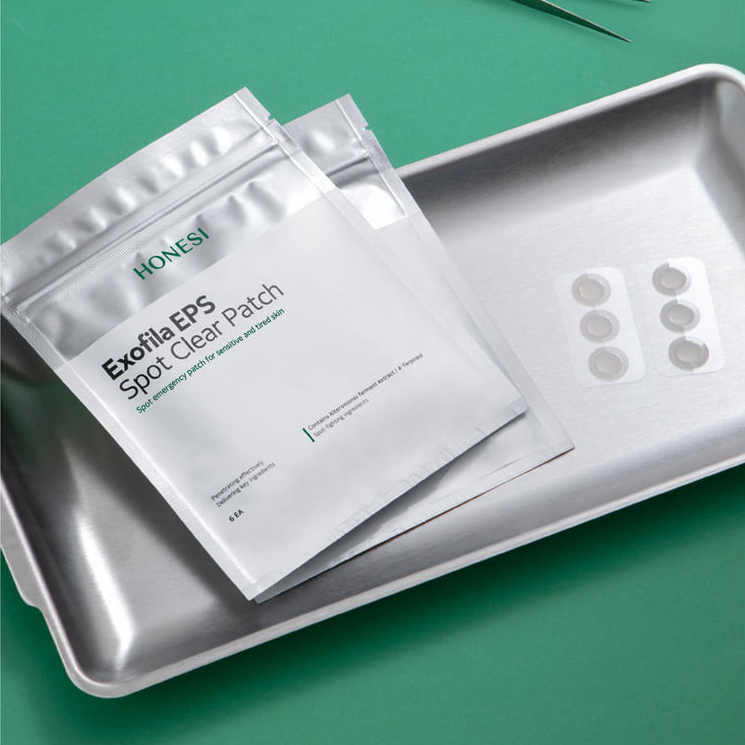 HONESI  Exophila EPS Spot Clear Patch (6 sheets) : patches autocollants sur plateau inox, marque HONESI, fond vert.