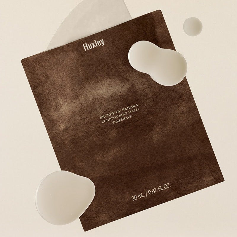 HUXLEY Conditioning Mask Freshape 20ml de Huxley, masque visage sur fond clair, packaging brun et formes cœur blanches.