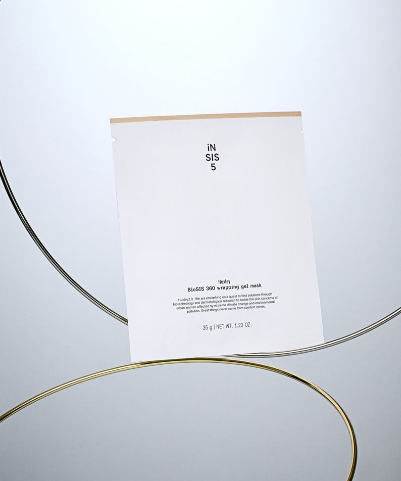 HUXLEY BioSIS 360 Wrapping Gel Mask 35g pour un soin de peau optimal avec des éléments visuels modernes et élégants en arrière-plan.