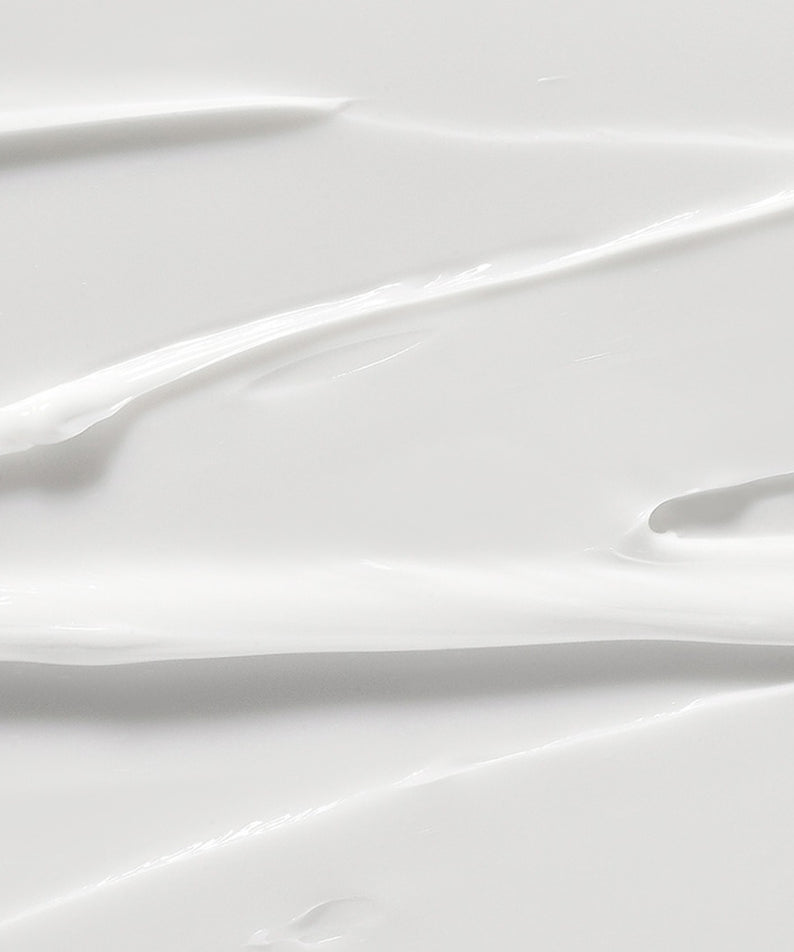 Texture crème blanche et lisse — ILLIYOON Ultra Repair Intensive Care Cream 200ml, en gros plan, fond clair.