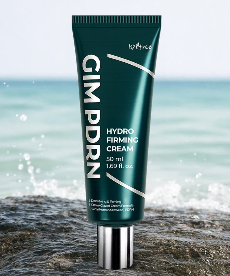 ISNTREE Kim PDRN Hydro Firming Cream 50ml, tube ISNTREE sur rocher, fond mer et vagues, scène soins visage.