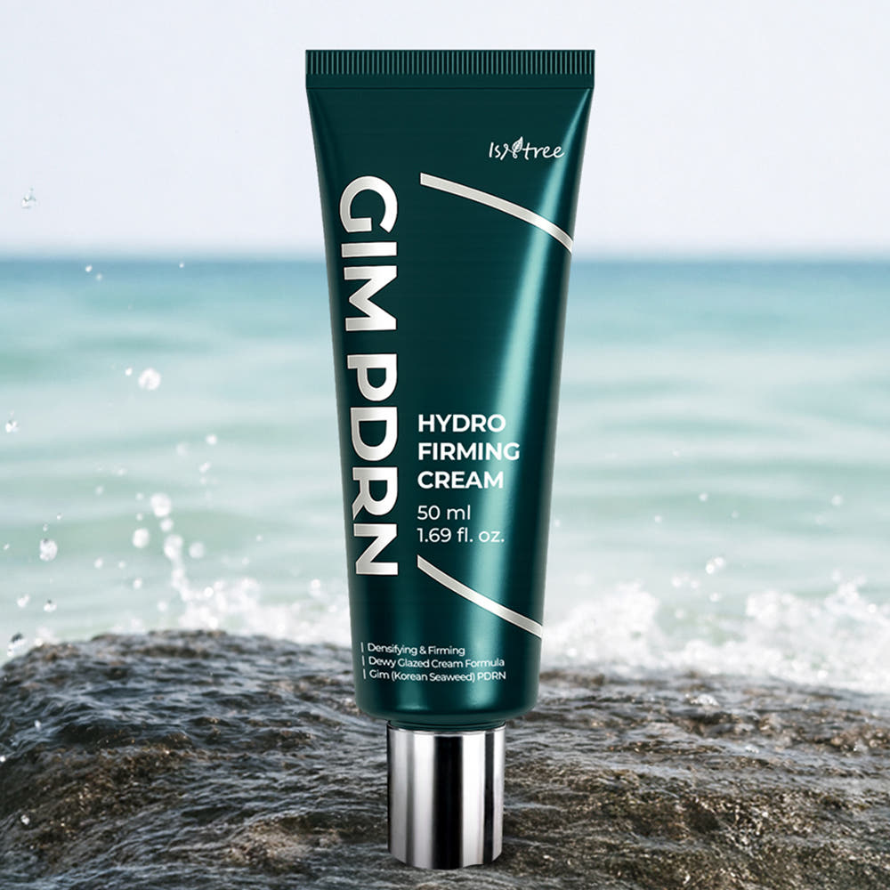 ISNTREE Kim PDRN Hydro Firming Cream 50ml, tube ISNTREE sur rocher, fond mer et vagues, scène soins visage.