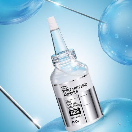IS0I NDS Point Shot 2000 Ampoule 38ml ISOI, flacon sérum en contexte laboratoire/bleu avec pipettes et gouttes.