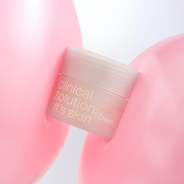 IT'S SKIN Snail Collagen Active Cream 50ml, pot crème en gros plan sur fond rose, branding IT'S SKIN, produit cosmétique.