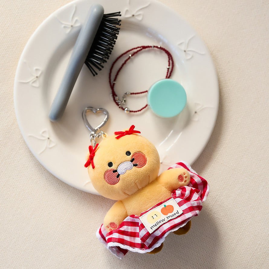 KAKAO FRIENDS Scrunchie Keyring Check : porte-clés scrunchie avec personnage sur fond clair, marque KAKAO FRIENDS.