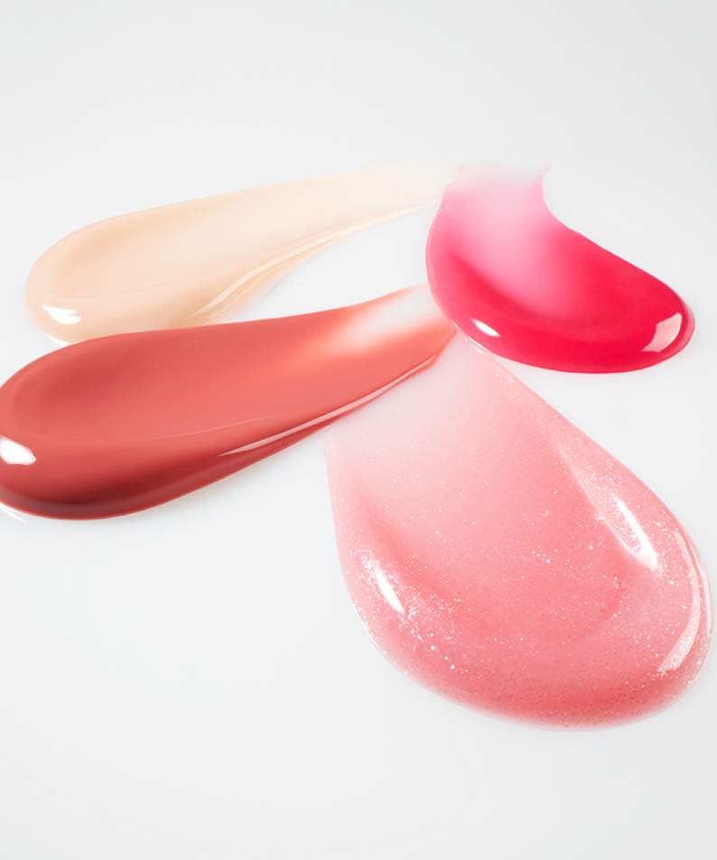 Décris l'image en français en mentionnant le produit, la marque et le contexte visuel: LANEIGE Lip Glowy Balm (Milky Way/Pink Supernova) 10g, baume brillant rose.