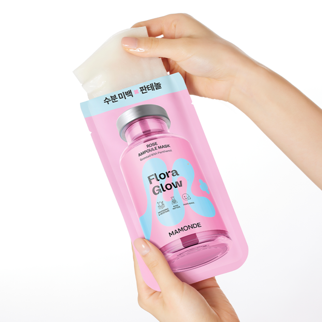 Main tenant MAMONDE Flora Glow Rose Ampoule Mask Pack, masque rose Flora Glow de la marque MAMONDE sur fond blanc.