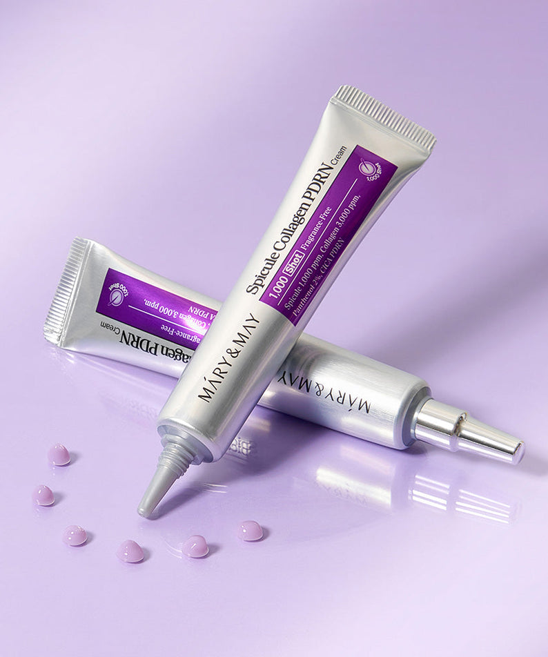MARY&MAY  Speckle Collagen PDRN Cream 15g, tube sur fond violet avec gouttes, contexte beauté.