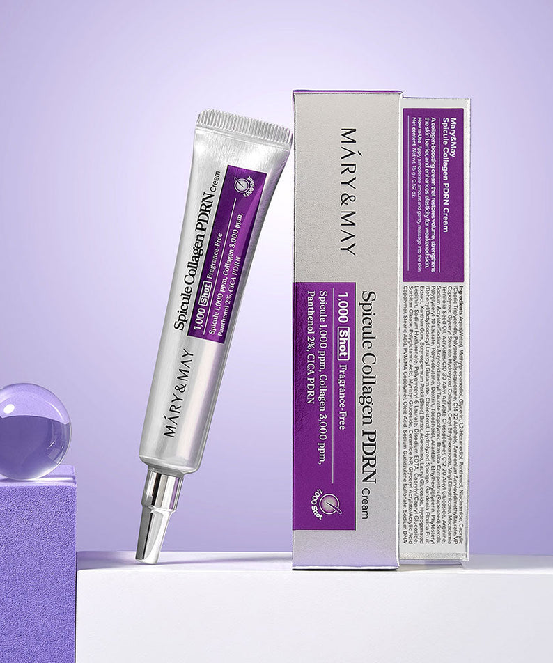 Décris l'image en français : MARY&MAY  Speckle Collagen PDRN Cream 15g, tubes et boîte sur fond violet.